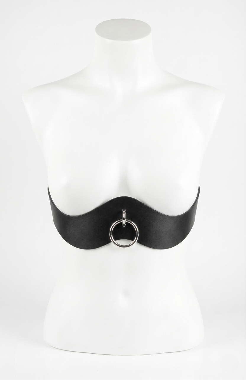 Black corset with a circular pendant on a mannequin against a white background